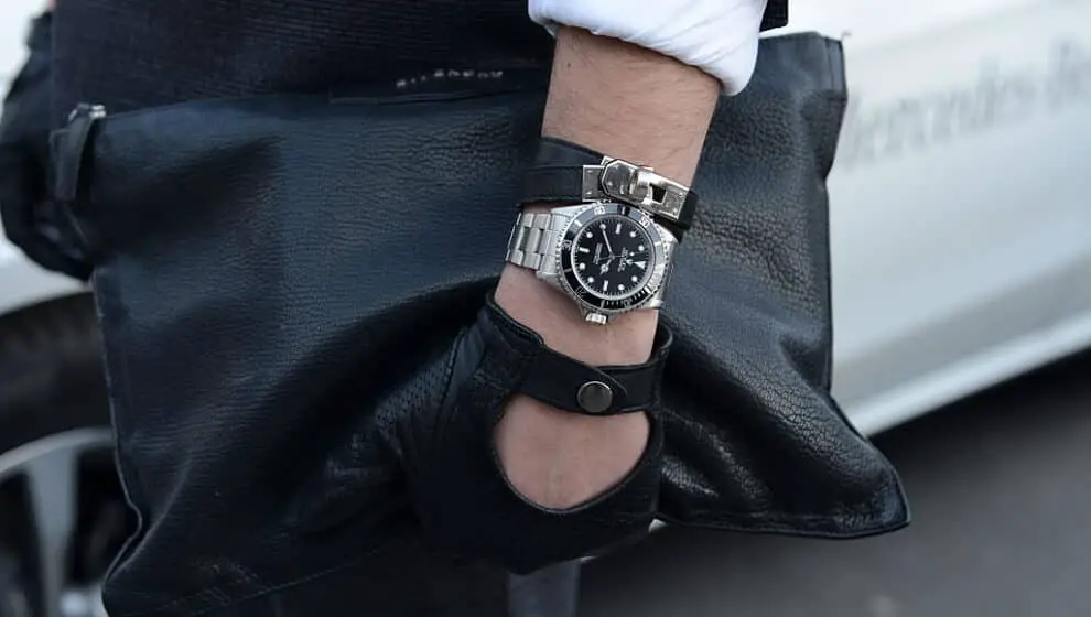 Ali Bayramoglu poses wearing glove by Que, watch by Rolex