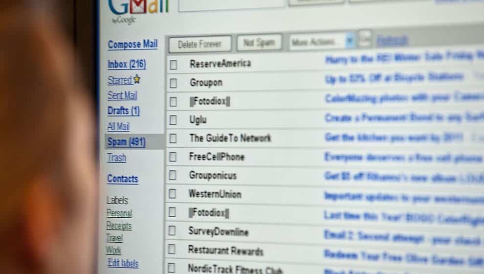 Employee reading through Gmail account